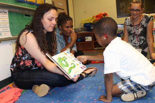 Child with Hearing Aid during Reading circle